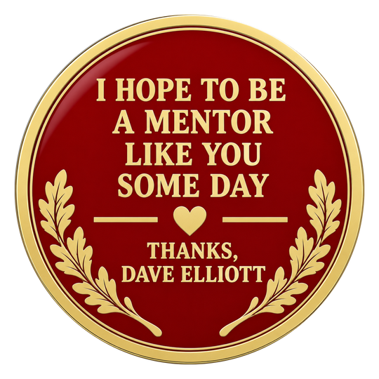 A round red and gold plaque or sticker with the text 'I HOPE TO BE A MENTOR LIKE YOU SOME DAY THANKS, DAVE ELLIOTT' and gold laurel branches on a white background.